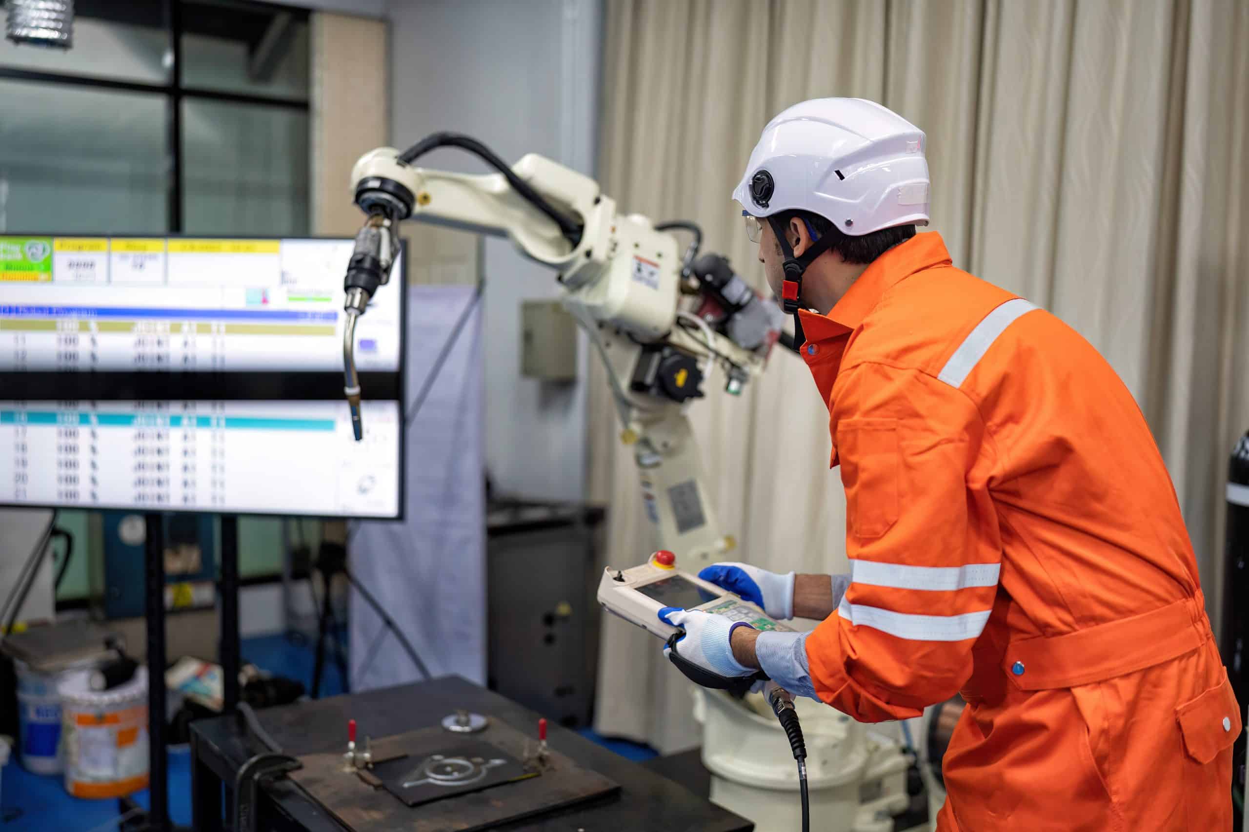 Technician working on an industrial robot